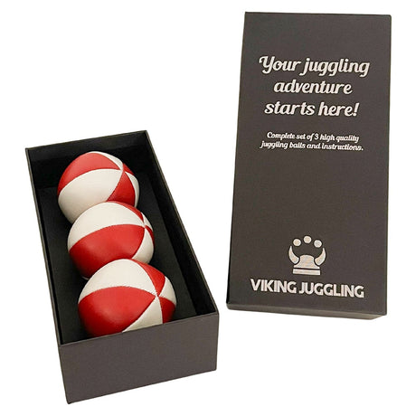 Ett set med tre röd-vita 6-panel jongleringsbollar i konstläder snyggt presenterade i en svart ask från Viking Juggling.
