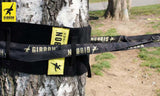 Närbild på Gibbon TreeWear och rundslinga monterad runt träd – säker och skonsam slacklineförankring